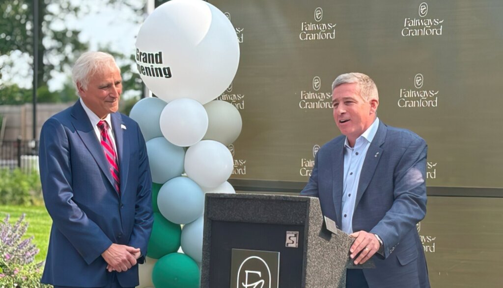 Lou March Jr. (right), president of Wayne-based March Associates Construction, speaks alongside Hartz Mountain President and Chief Operating Officer Gus Milano during the ribbon-cutting ceremony at Fairways at Cranford in Cranford. - Photo Credit: Real Estate NJ